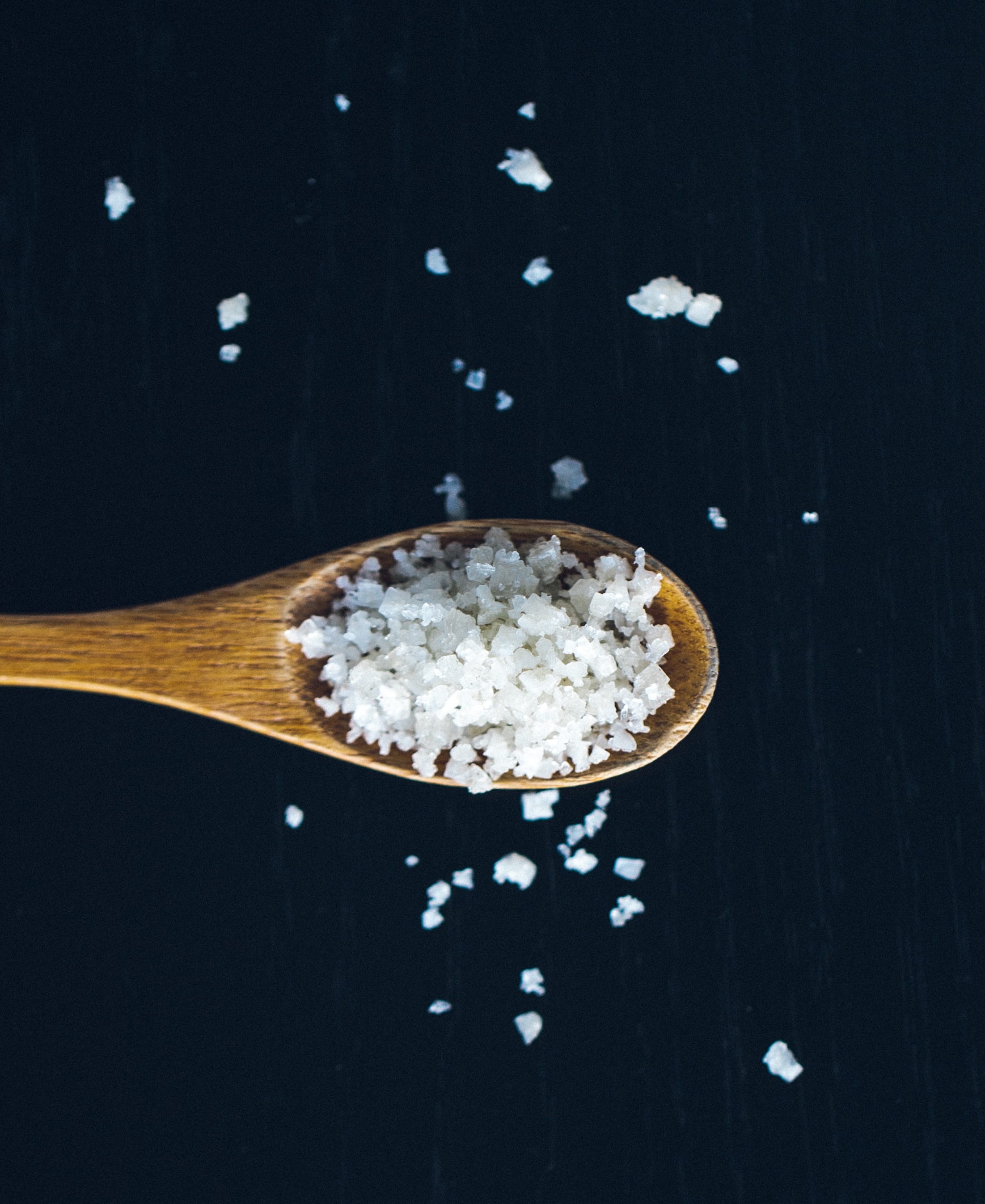 Sea salt on wooden spoon